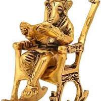 Golden Lord Ganesha Statue Sitting On A Rocking Chair And Reading Ramayan Showpiece